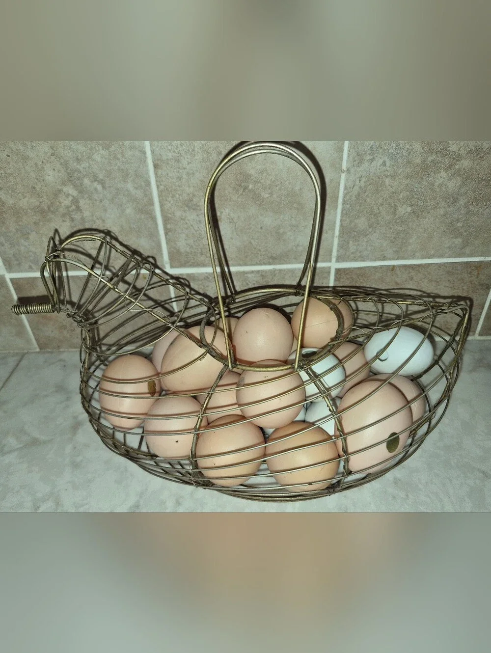 Vintage-style wire egg basket is shaped like a hen